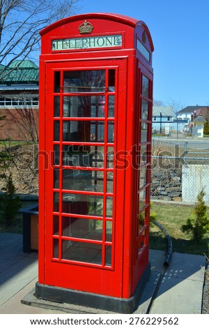 SUTTON QUEBEC CANADA APRIL 30 2015: The red telephone box, a telephone kiosk for a public telephone designed by Sir Giles Gilbert Scott, was a familiar sight on the streets of the United Kingdom