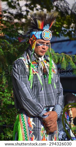 VICTORIA BC CANADA JUNE 24 2015: Native Indian people in traditional costume. First Nations in BC constitute a large number of First Nations governments and peoples in the province of British Columbia