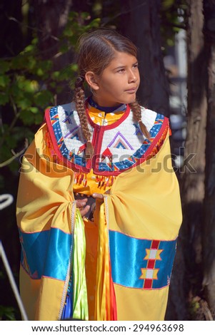 VICTORIA BC CANADA JUNE 24 2015: Unidentified Native Indian girl in traditional costume. First Nations in BC constitute a large number of First Nations governments and peoples in the province of BC