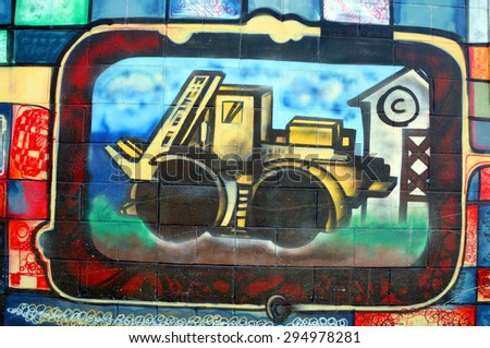 VICTORIA BC CANADA JUNE 22 2015: Industrial machine mural in Victoria is the perfect place to walk in the back alleys and abandoned areas, looking for street art