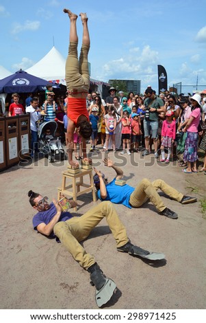 MONTREAL QUEBEC CANADA JULY 03 2015: Street acrobat  Montreal  during the days of its operation offering kid friendly activities including street performers as well as the Centre du Spectacle