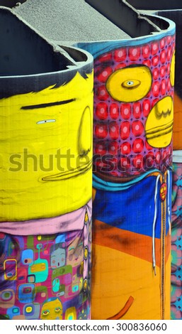 VANCOUVER BC CANADA JUNE 10 2015: Ocean Concrete is Granville Island last tie to to its industrial past, and now 6 concrete silos are being transformed by two famous Brazilian street artists Os Gemeos