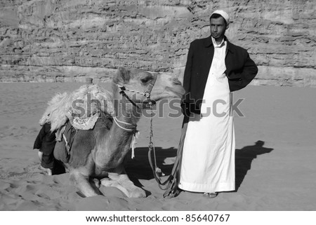 PETRA-JORDAN NOV 25:Unidentified man waits for tourists for camel ride on Nov 25, 2009 Petra, Jordan. Ride cost 20JD. Petra was the impressive capital of the Nabataean kingdom from around the 6th century BC