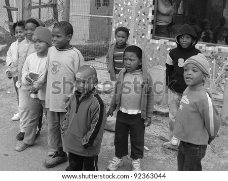 KHAYELITSHA, CAPE TOWN - MAY 22 : A unidentified group of young children play on a street of Khayelitsha township, on May 22, 2007, Cape Town, South Africa