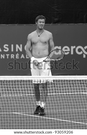MONTREAL - AUGUST 5: Marat Safin without shirt on court of Montreal Rogers Cup on August 5, 2009 in Montreal, Canada. Safin won two majors and reached the world number 1 ranking during his career.