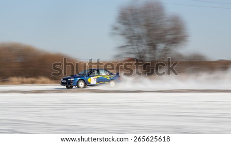 Moscow, Russia - march 1, 2014: Car on ice in motion. Driving subarus on frozen pond.