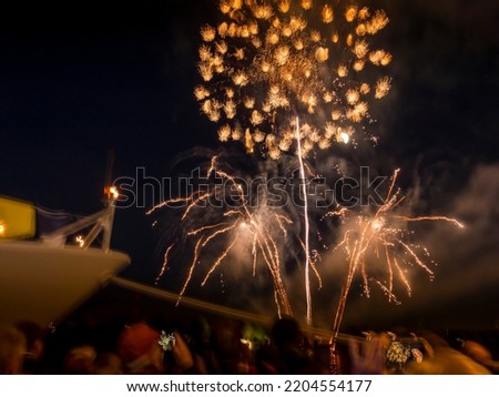 Beautiful Armada fireworks glowing over the Seine river with one big boat crowding the water and the dock. France Foto stock © 