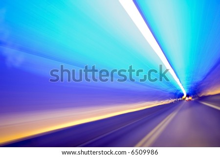 Car lights trails in a tunnel - long exposure photo taken in a tunnel