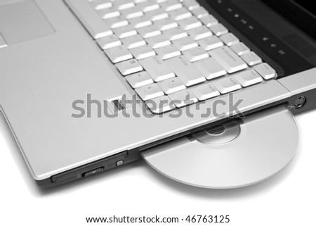 laptop close-up with a dvd disk in it