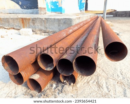 Similar – Image, Stock Photo Stacked up, rusty metal barrels are reflected in puddle