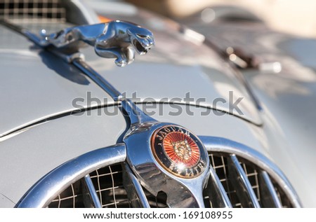 SAMARA, RUSSIA - JUNE 16, 2013: Photo of a Jaguar logo on a retro car Jaguar MkII. Jaguar was founded in 1922 it is a British multinational luxury car manufacturer