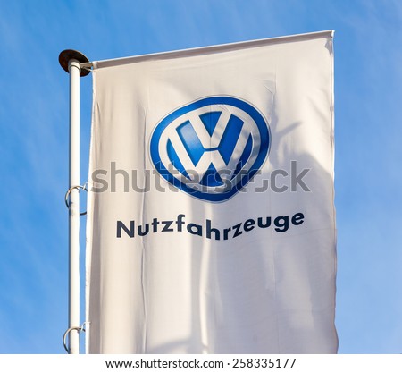 SAMARA, RUSSIA - MARCH 1, 2015: The flag of Volkswagen over blue sky. Volkswagen is the biggest German automaker and the third largest automaker in the world