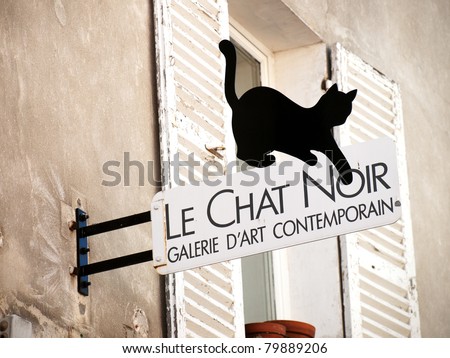 PARIS, FRANCE – AUGUST 16: The Black cat sign on art-gallery in Montmartre, Paris on August 16, 2009. Le Chat Noir is the famous poster sign of cabaret in the Montmartre. Now it became symbol of Paris