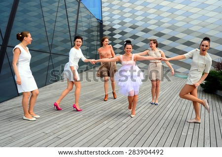 Beautiful lovely girls group dancing in Vilnius city.