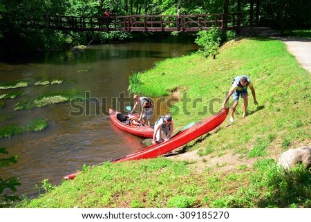 VILNIUS, LITHUANIA - JUNE 28: Canoes in River Vilnele near Entertainment and Recreation Center Belmontas on June 28, 2015, Vilnius, Lithuania.