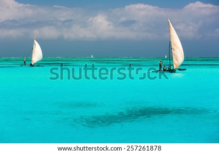 Two catamarans on amazing turquoise water in the Indian ocean next to Mnemba atoll, Zanzibar, Tanzania