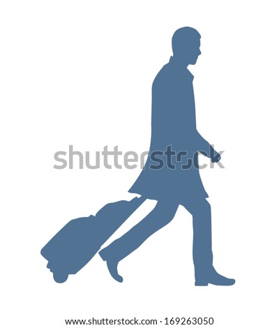 Silhouette Of A Business Man Travelling With A Rolling Suitcase