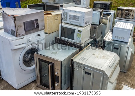 A Collection Of Domestic Applicance (Ovens, Microwaves And Washing Machines) Left At A Dump Or Recycling Center