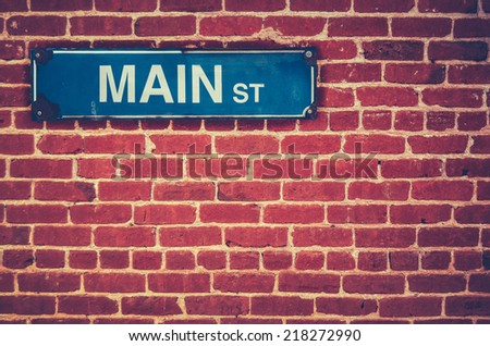 Retro Filtered Photo Of A Main Street Sign On A Red Brick Wall ストックフォト © 