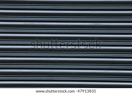 Abstract background texture of scuffed shop shutters