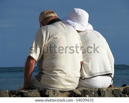 Retirement Image of a Senior Couple on Vacation By the Sea