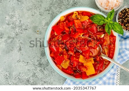 Vegetable dish of stewed sweet peppers and tomatoes, lecho, vegetarian menu. Studio Photo Stock fotó © 
