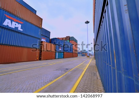 XIAMEN - APRIL 21: Container goods yard in harbor of Xiamen, Fujian, South of China in April 21, 2013. Xiamen is a developing harbor city located in South-East of China.