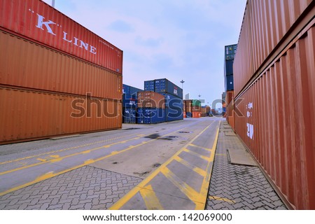 XIAMEN - APRIL 21: Container goods yard in harbor of Xiamen, Fujian, South of China in April 21, 2013. Xiamen is a developing harbor city located in South-East of China.