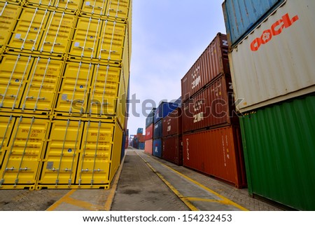 XIAMEN - APRIL 21: Container goods yard in harbor of Xiamen, Fujian, South of China in April 21, 2013. Xiamen is a developing harbor city located in South-east of China.