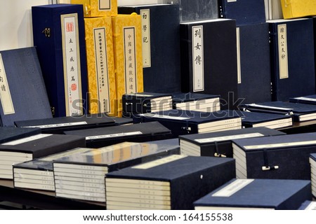 XIAMEN - OCTOBER 26: Chinese books in traditional style, in Xiamen City, South of China in October 26, 2013. Xiamen is a developing harbor city located in South-east of China.