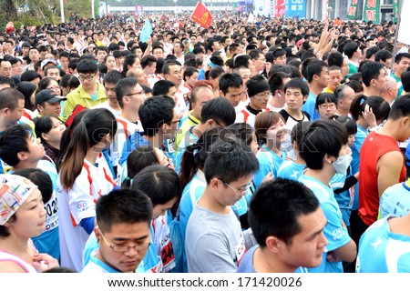 XIAMEN, CHINA- JANUARY 2: Crowd of participants in International marathon in Xiamen, China, January 2, 2014. Xiamen is a famous harbor city located in South-east of China.