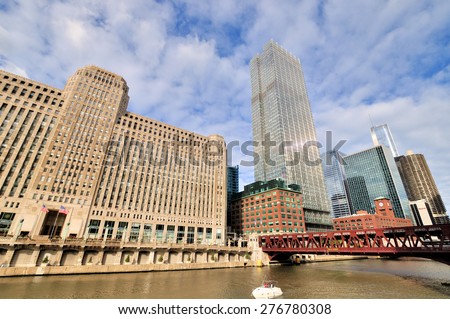 CHICAGO, USA - OCTOBER 6: Chicago Merchandise Mart and City buildings beside Chicago river in downtown of Chicago, Illinois, in October 6th, 2014.Chicago is the biggest city in North of USA.