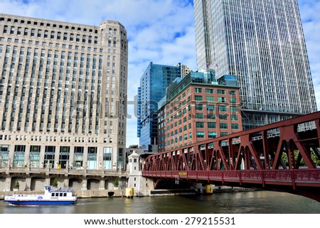 CHICAGO, USA - OCTOBER 6: Chicago city buildings and Merchandise Mart beside Chicago river in downtown of Chicago, Illinois, in October 6th, 2014.Chicago is the biggest city in North of USA.