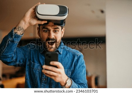 Man using the phone and virtual reality. Education and fun Imagine de stoc © 