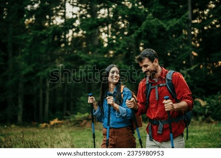 Image, Stock Photo Backpacker trekking in autumn forest