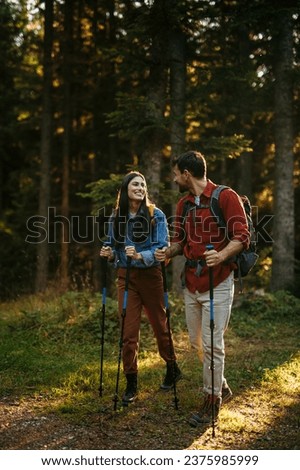 Similar – Image, Stock Photo Backpacker trekking in autumn forest