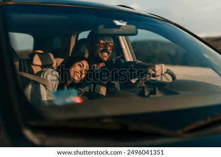 Similar – Image, Stock Photo Adventurer leaning on the door of an off-road car