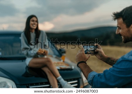 Similar – Image, Stock Photo Man takes a sunset photo on the phone