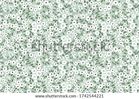 Elegant floral pattern in small white flowers. Liberty style. Floral seamless background for fashion prints. Ditsy print. Seamless vector texture. Spring bouquet.