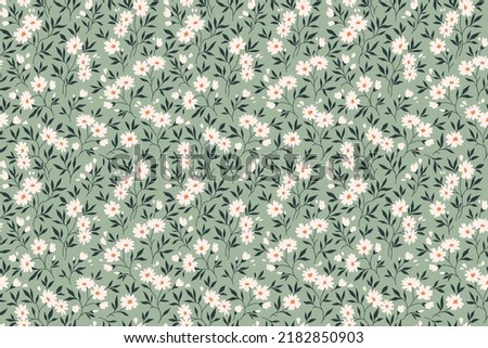 Trendy seamless vector floral pattern. Endless print made of small white flowers. Summer and spring motifs. Gray blue green background. Stock vector illustration.
