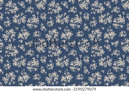 Vintage floral pattern in small abstract flowers. Small ivory white flowers. Blue background. Ditsy print. Floral seamless background. The elegant the template for fashion prints. Stock pattern.