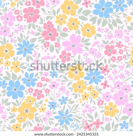 Retro floral pattern in small decorative flowers. Small blue, yellow pink flowers. White background. Ditsy print. Floral seamless background ditsy pattern in small cute wild flowers.