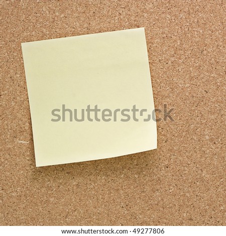 closeup of note paper on cork board