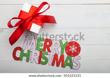 Christmas Presents With Sign On Wooden Background. Focus On Sign Stock