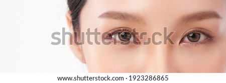 close up of beauty asia woman eye on white background. 