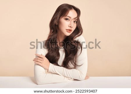 Similar – Image, Stock Photo Portrait of a beautiful dark-haired young sexy woman lying happily contentedly in bed of moss in the forest with in an old willow tree with naked shoulders and deep peace in the smile