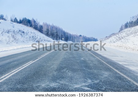 Similar – Foto Bild Winter verschneite leere Landstraße