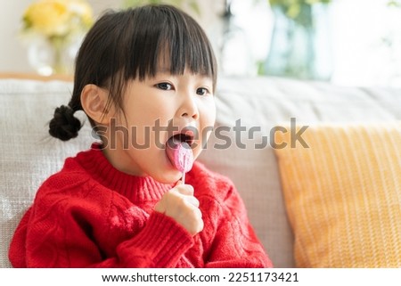 Similar – Image, Stock Photo Child with lollipop