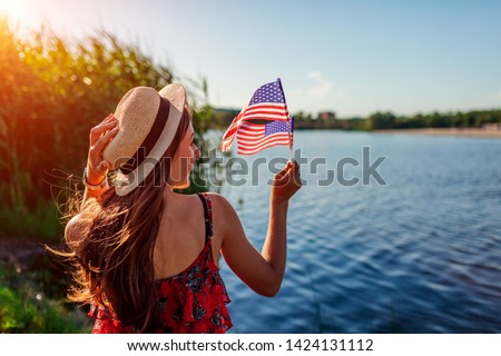 Similar – Image, Stock Photo American woman with flag sitting on road