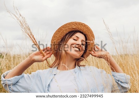 Similar – Image, Stock Photo Woman walking and balancing on a wooden railing at the coast line.